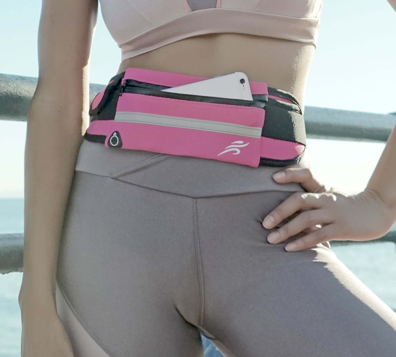 Pink and gray fanny pack with zipper and adjustable strap worn at the waist