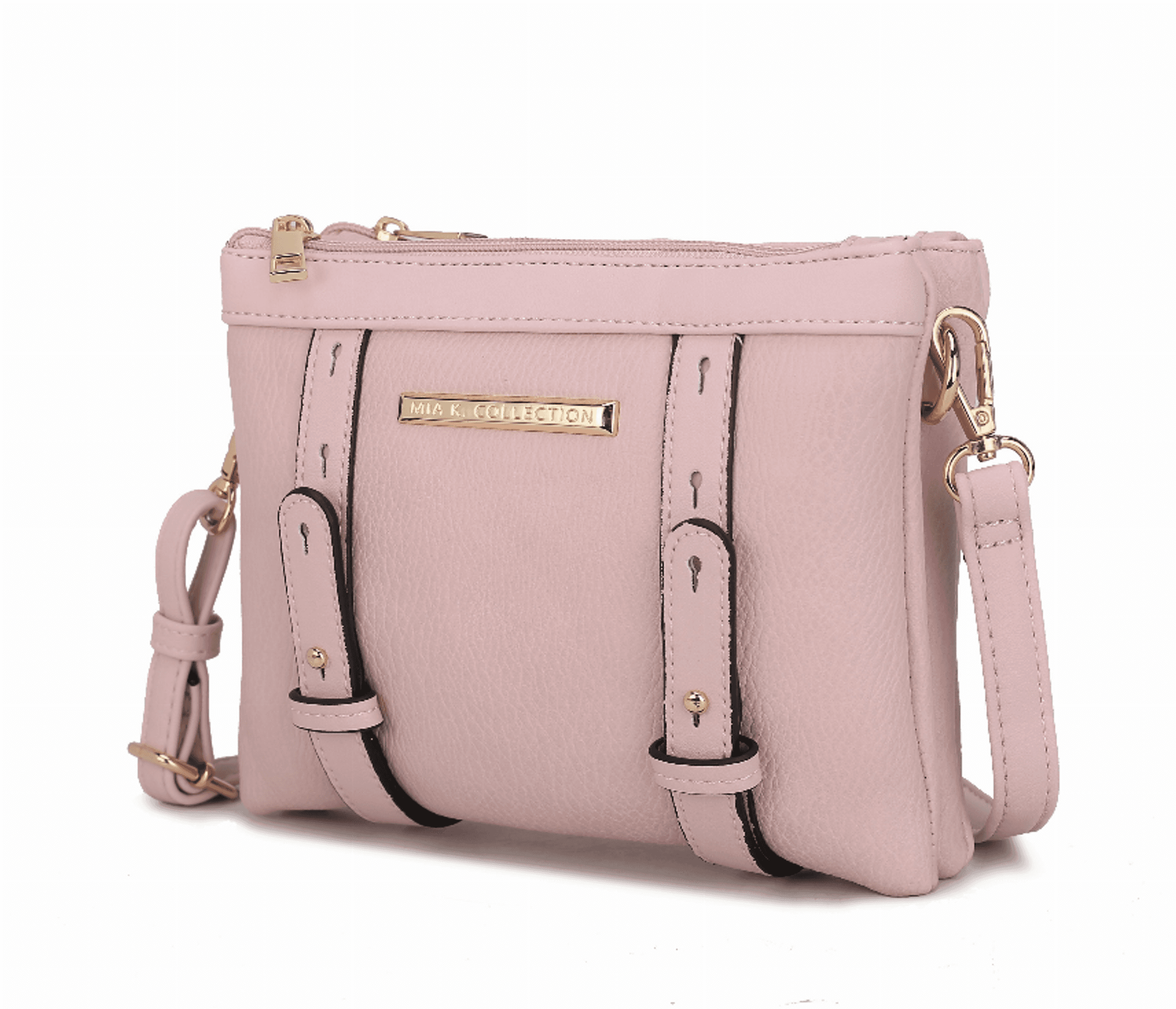 Pink multi-compartment crossbody bag with gold hardware and adjustable strap