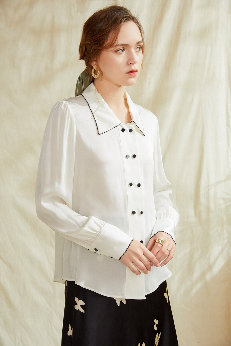 White silk button-up shirt with contrast collar trim and front buttons