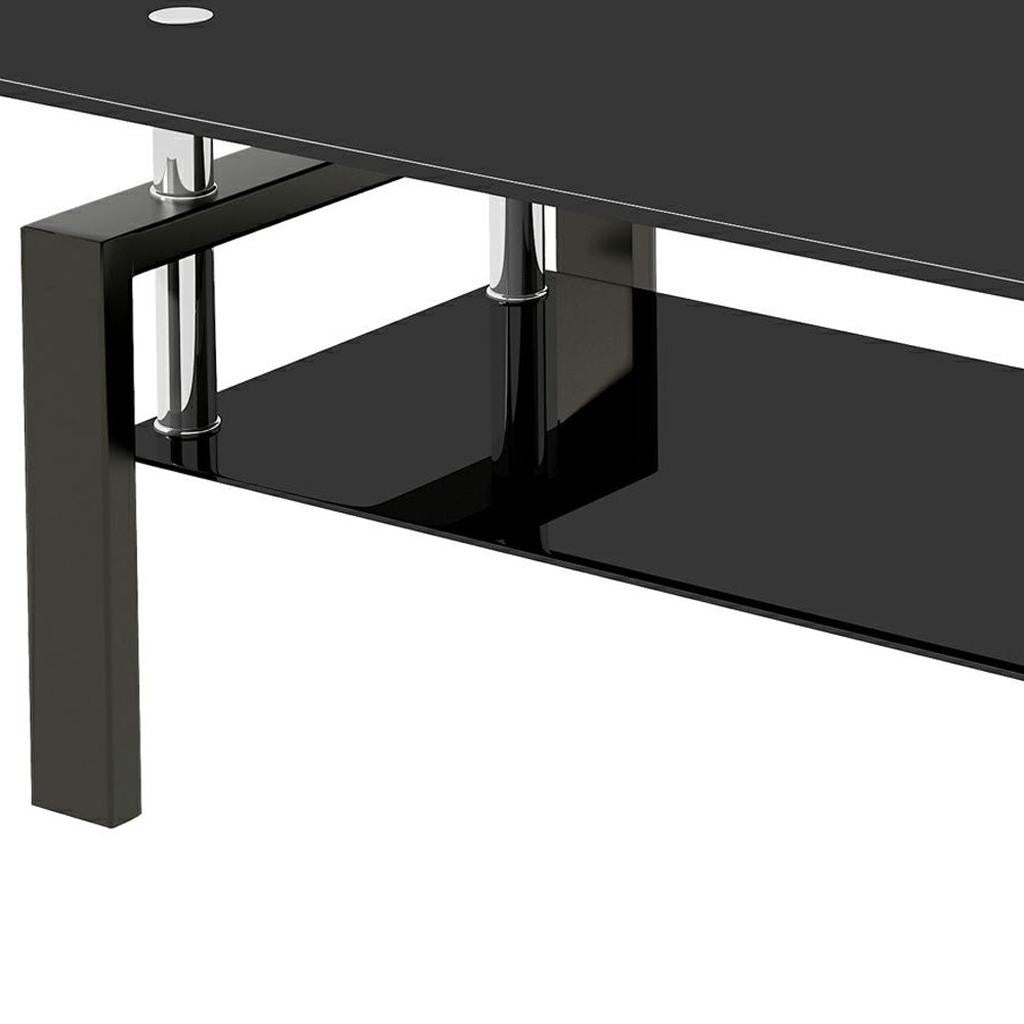 Corner view of black glass coffee table with chrome post and black base shelf
