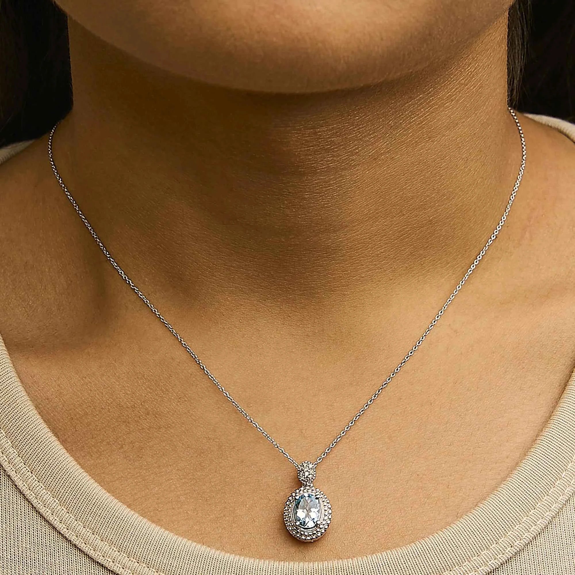 .925 Sterling Silver Oval Blue Topaz and Diamond Accent with Beaded Halo Pendant Necklace - 18" Inches