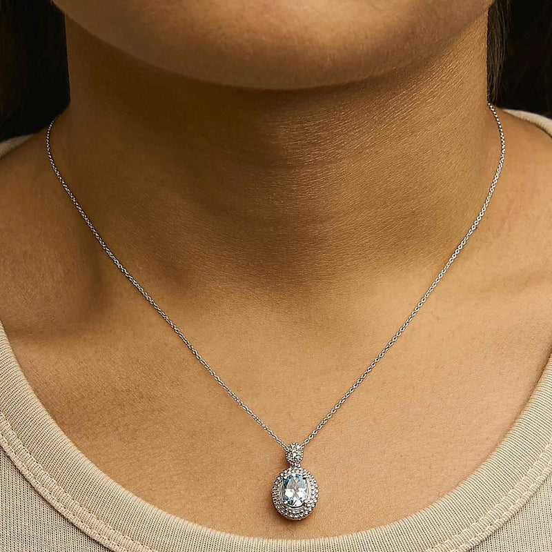 .925 Sterling Silver Oval Blue Topaz and Diamond Accent with Beaded Halo Pendant Necklace - 18" Inches