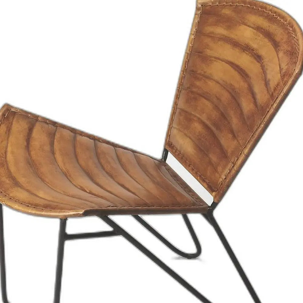 Rustic brown leather chair with curved seat design and black metal legs, perfect for modern industrial decor.