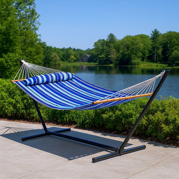 Double striped hammock in blue and light blue, with wooden spreader bars and white rope