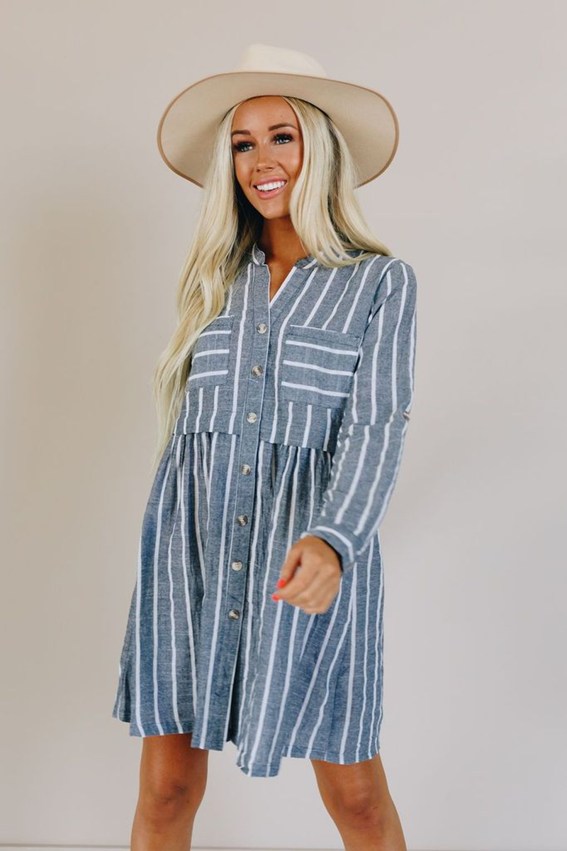 Blue pinstripe V-neck button dress with chest patch pockets and long sleeves