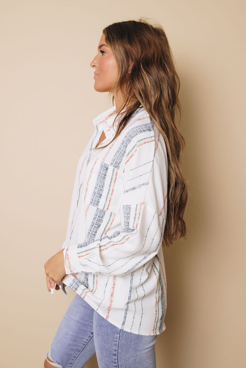 Striped button-down shirt, white with red and blue vertical lines, button front