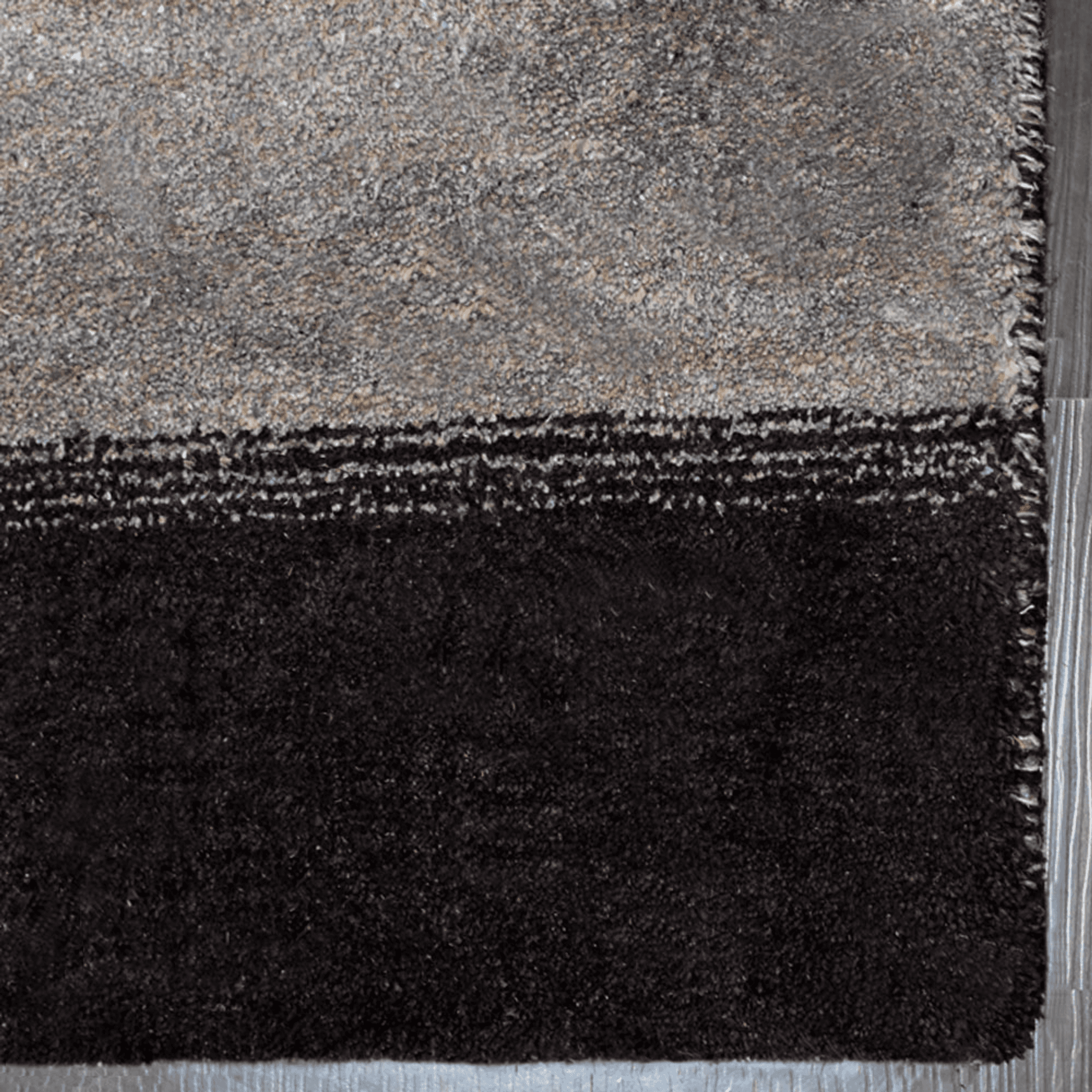 Hand-knotted area rug, dark charcoal and gray mottled with short fringed edge