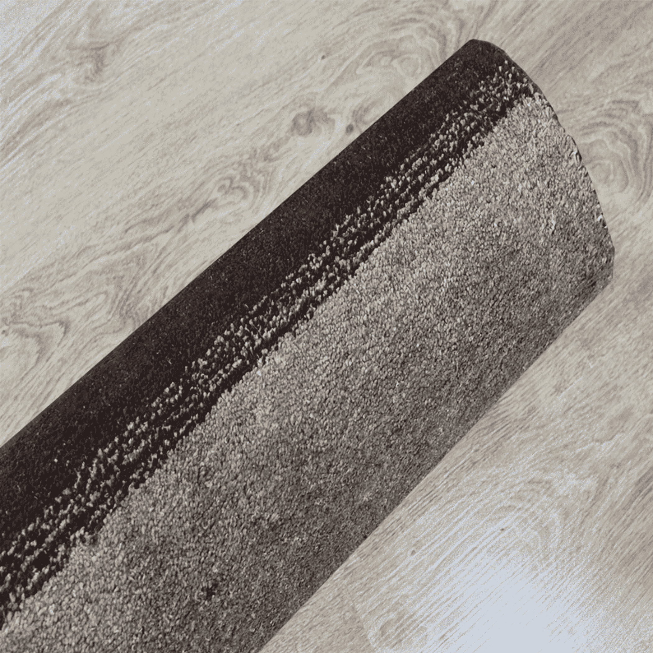 Contemporary area rug with diagonal stripe bands in brown, gray, and light beige.