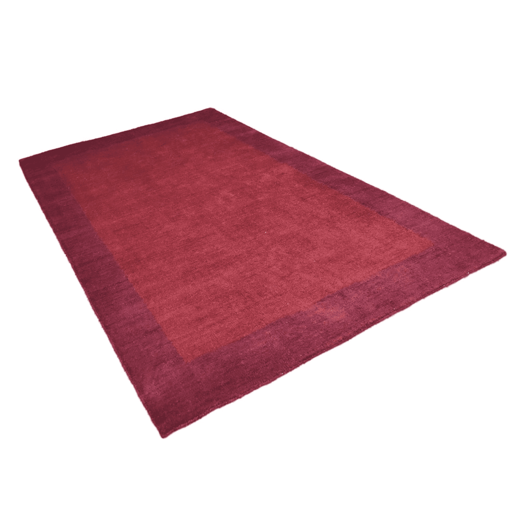 Maroon area rug with low, even weave in an angled view.