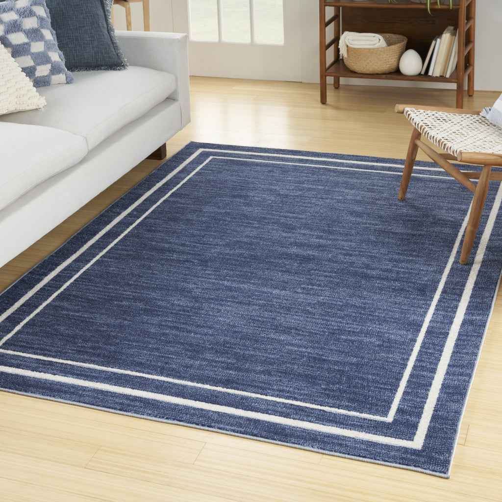 7' X 10' Navy Blue And Ivory Indoor Outdoor Area Rug