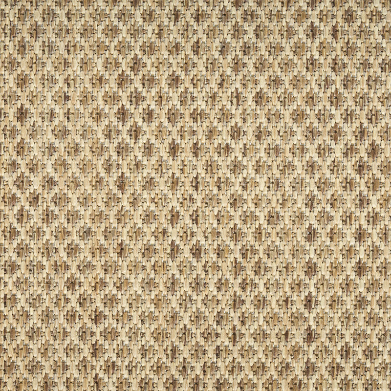 Tan geometric rug close-up showing dense looped weave pattern
