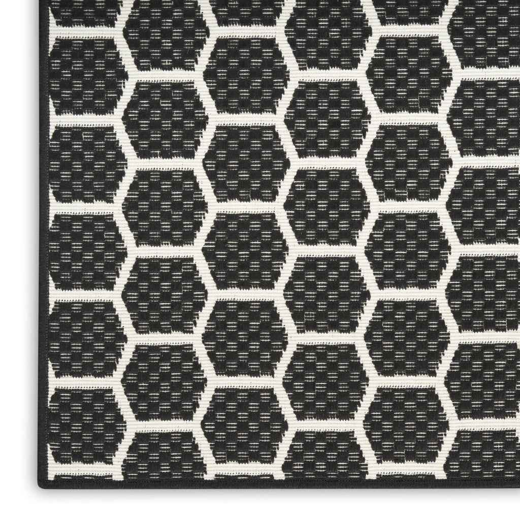 6' Black And Ivory Geometric Indoor Outdoor Area Rug