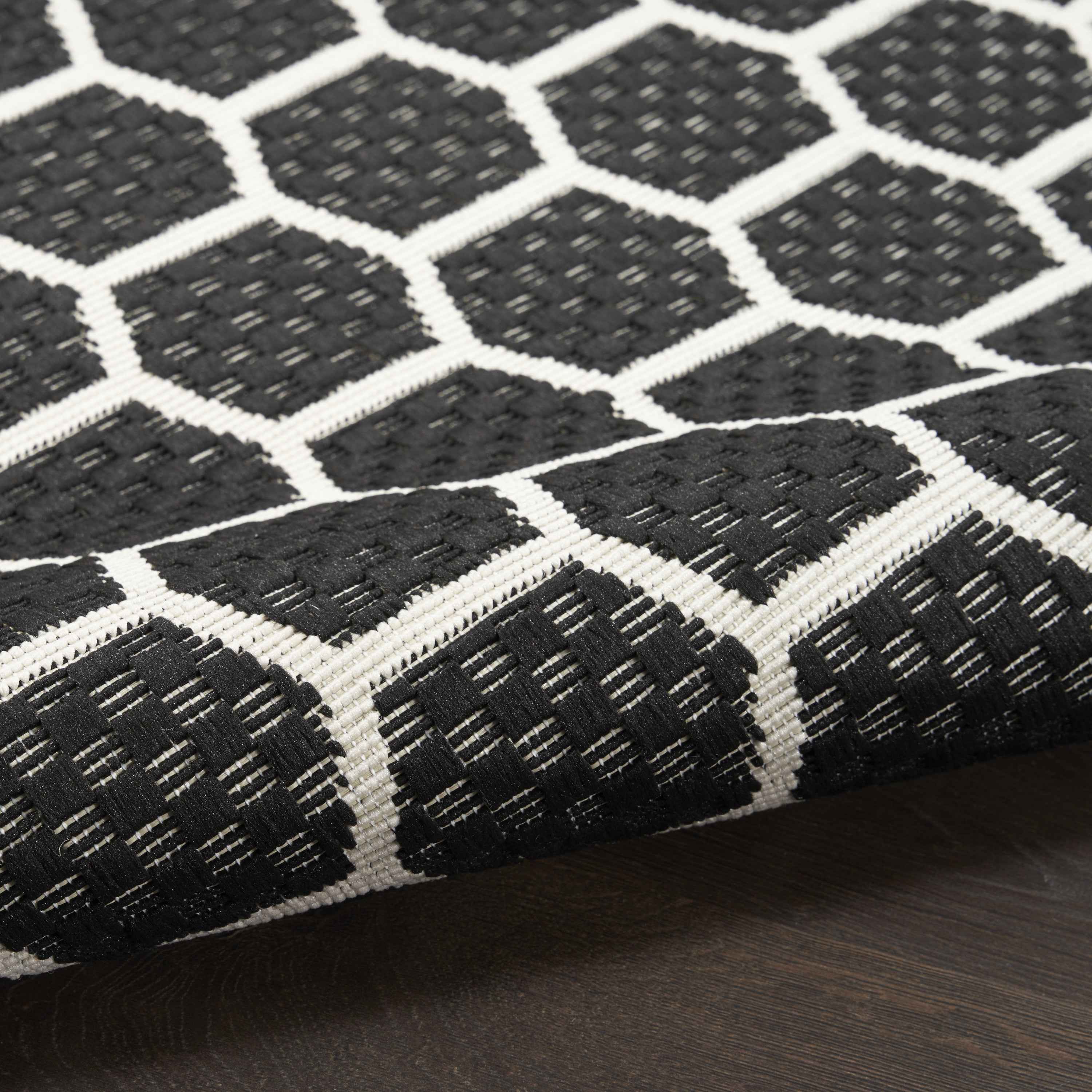 6' Black And Ivory Geometric Indoor Outdoor Area Rug