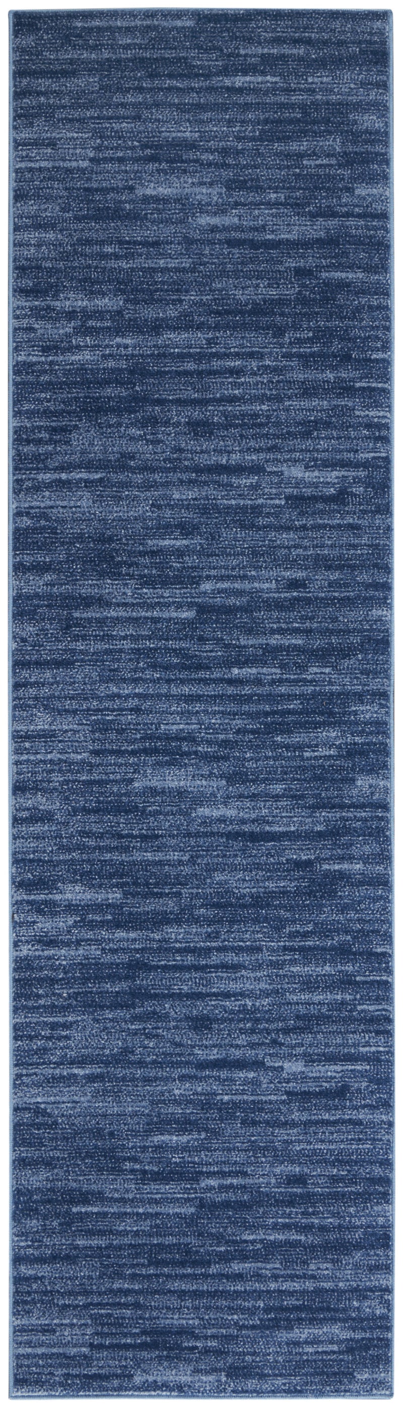 Blue runner rug with speckled texture and evenly spaced horizontal weave lines.