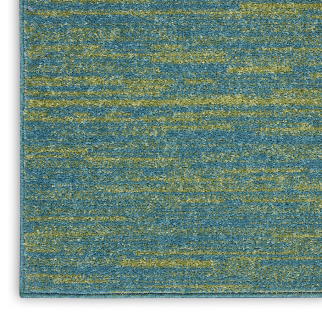 Blue and green textured area rug, soft synthetic material, modern design, ideal for contemporary interiors.