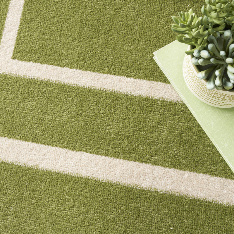 Green rug with ivory stripe bands and textured low-pile surface