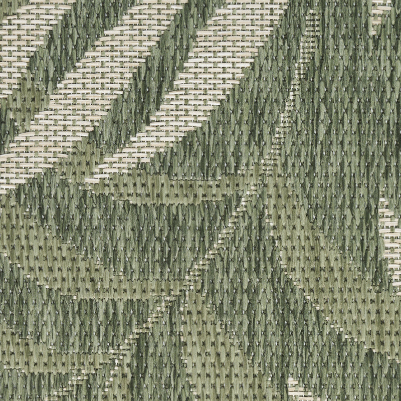 Green and ivory area rug with repeating vertical palm leaf details in woven texture