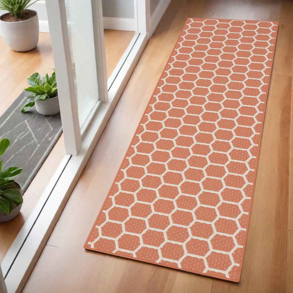 6' Coral And Ivory Geometric Indoor Outdoor Area Rug