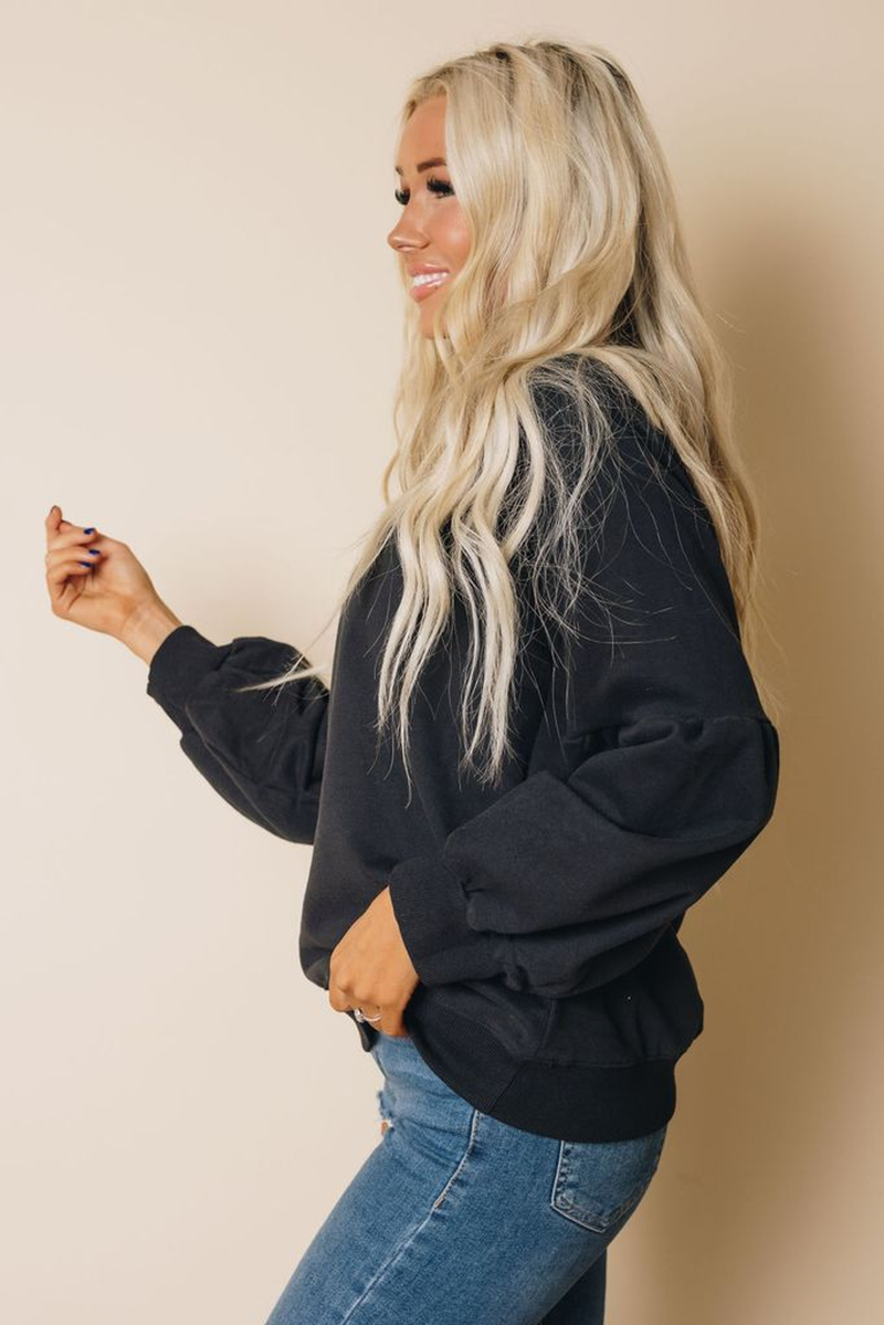 Balloon sleeve sweatshirt with crew neck and kangaroo pocket, dark charcoal, side view.