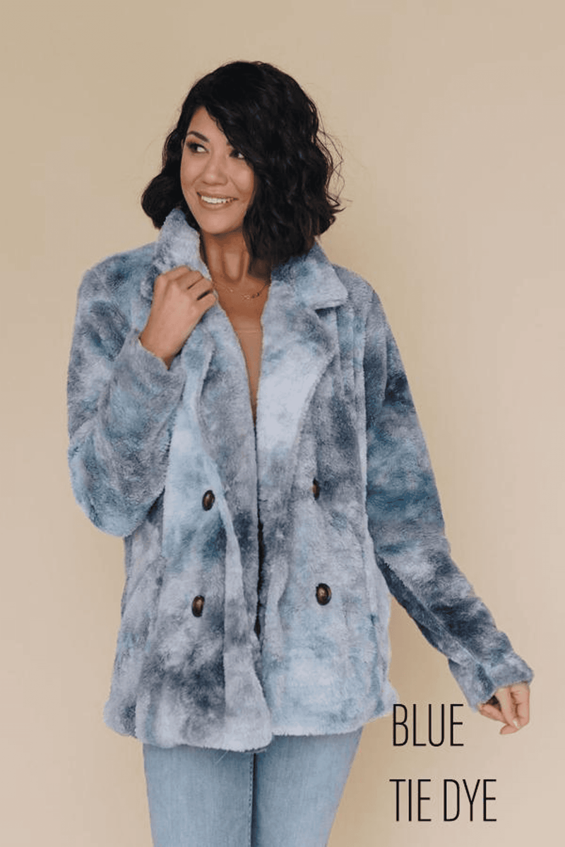 Blue tie-dye fleece coat with fuzzy texture, front button placket, and stand collar