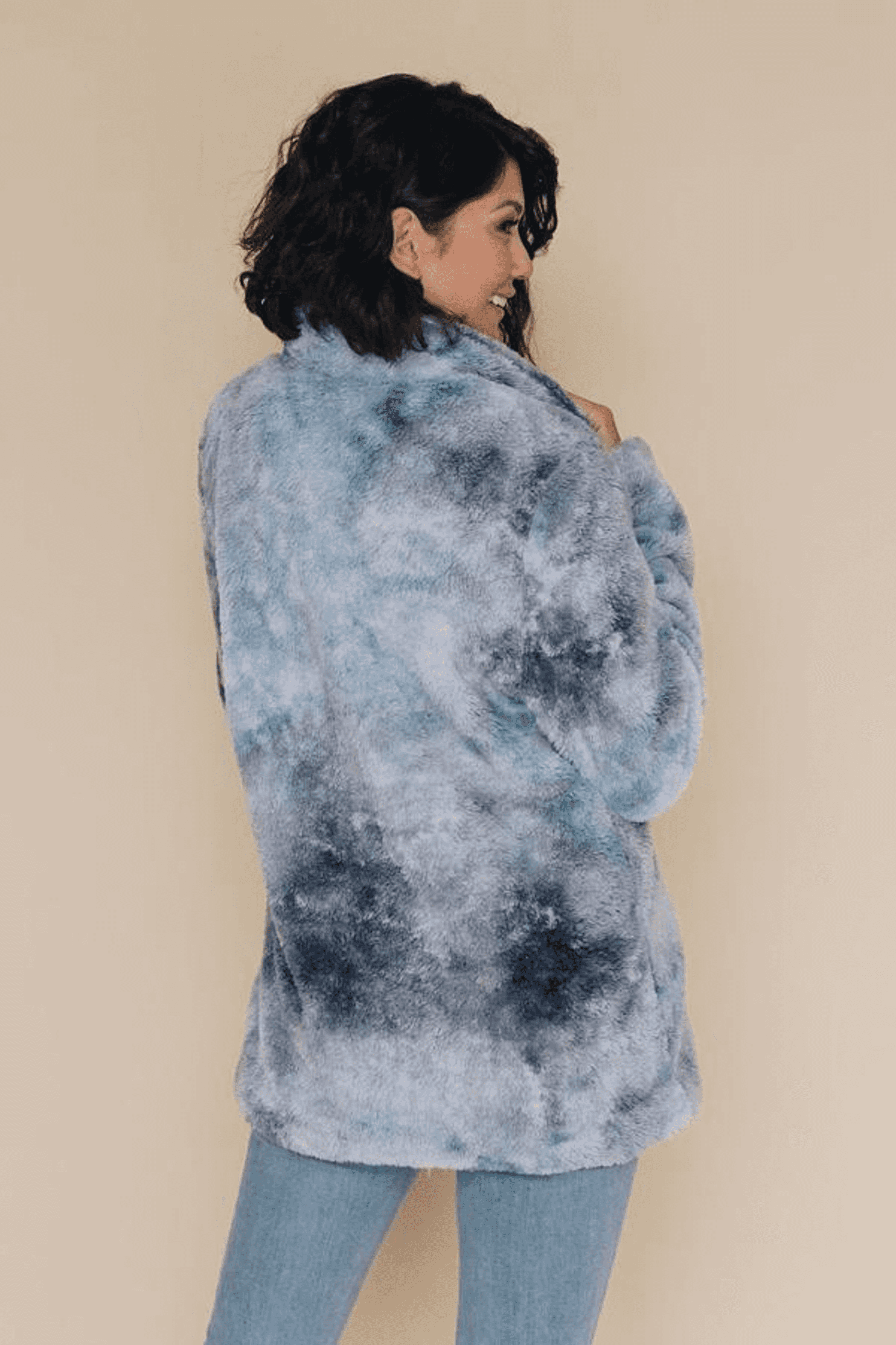 Blue tie-dye fleece coat with long sleeves, back view, and soft textured fabric