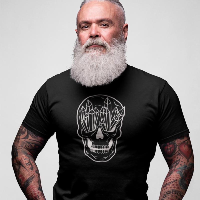 Black crew-neck T-shirt with white geometric skull graphic, front view with tattoos