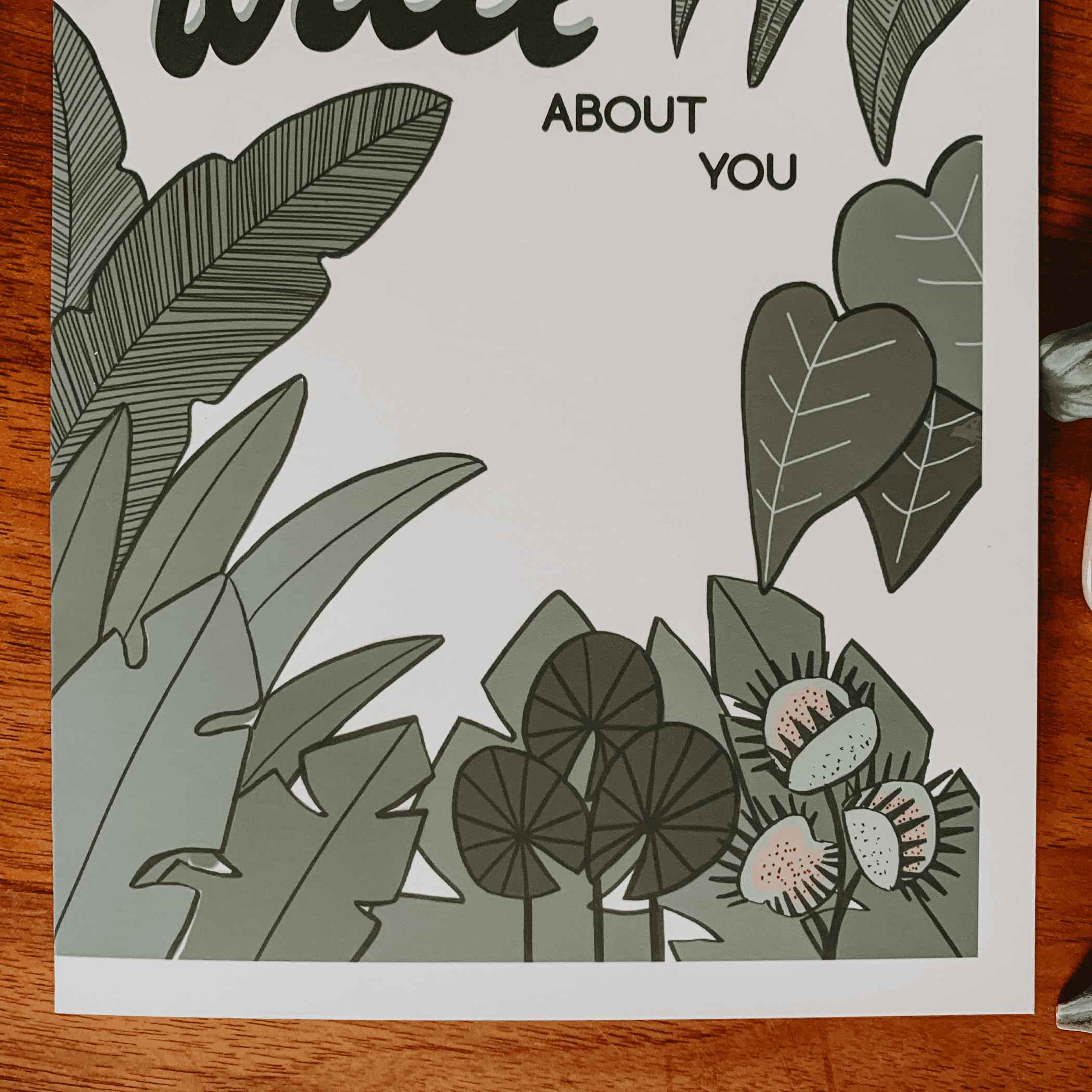 Botanical greeting card with green leaves and dark text reading "wild" and "ABOUT YOU".