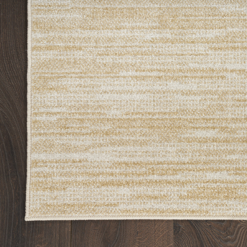 Ivory and gold abstract area rug corner view, low-profile woven texture