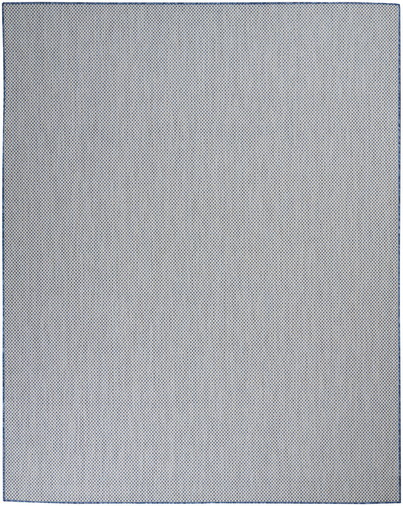 Light ivory area rug with fine speckled texture and dark outline border