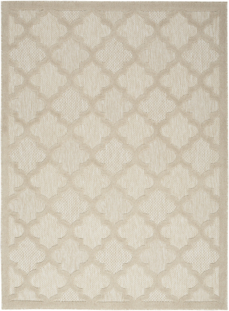 Cream area rug featuring repeating trellis quatrefoil motif across the surface