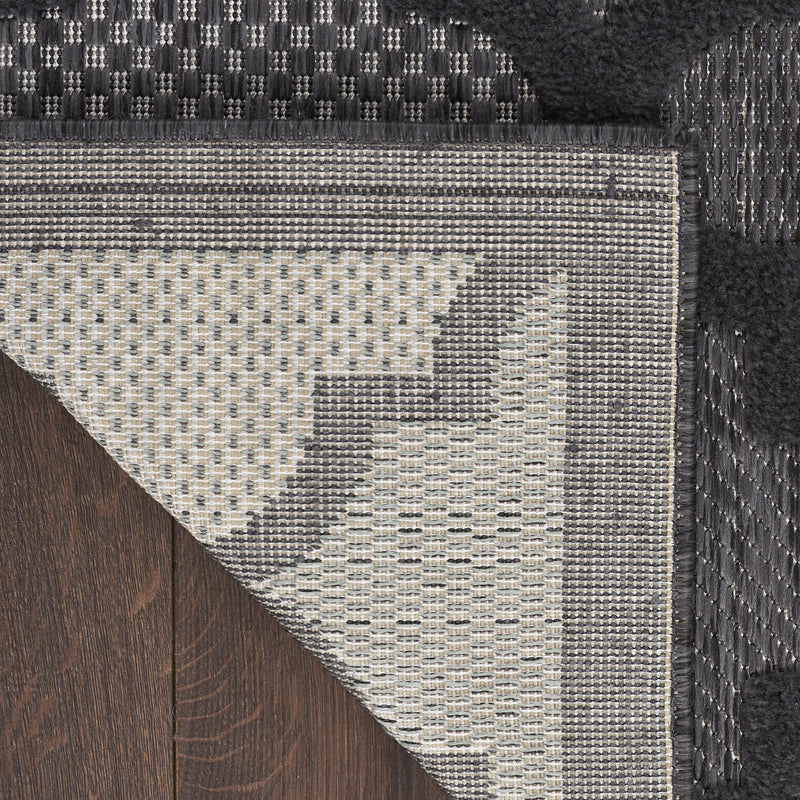Charcoal trellis runner rug with textured weave and contrasting light border edge