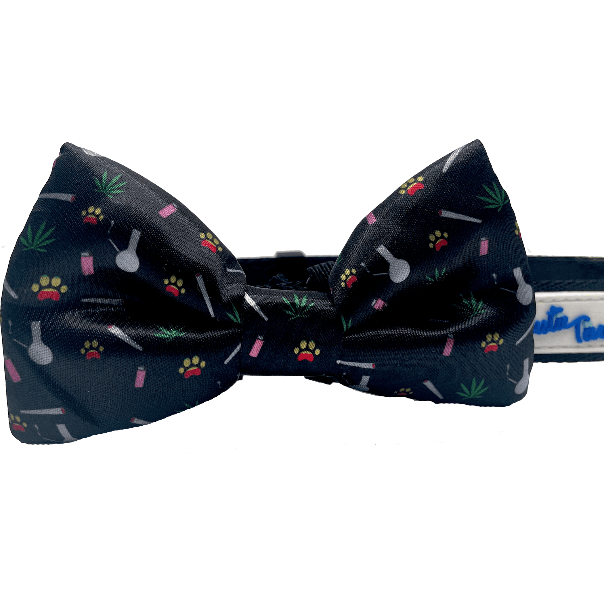 Navy dog collar with attached bow featuring paw prints, bones, and leaf accents.