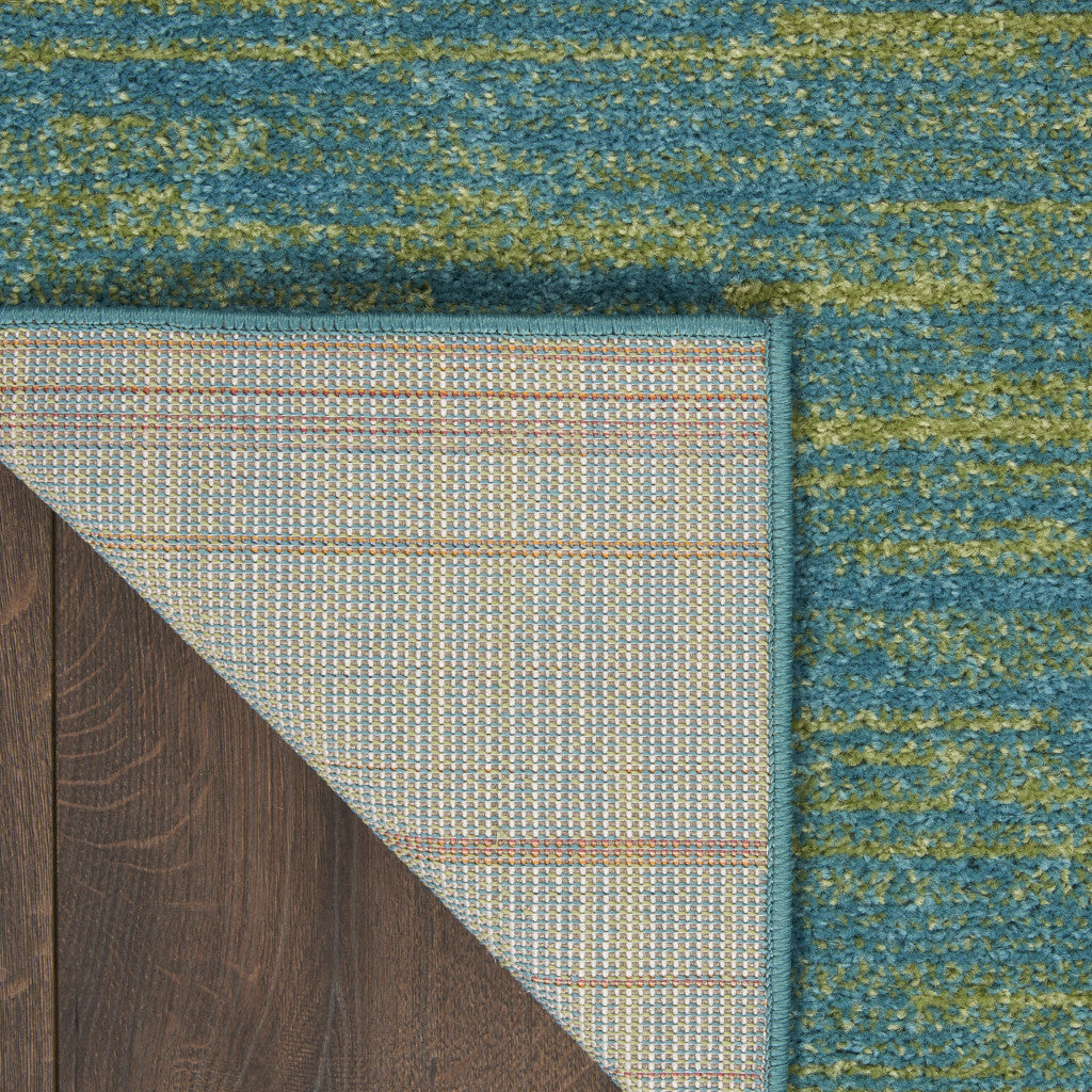 Teal and green textured area rug with a plaid backing, perfect for adding color and style to any room.
