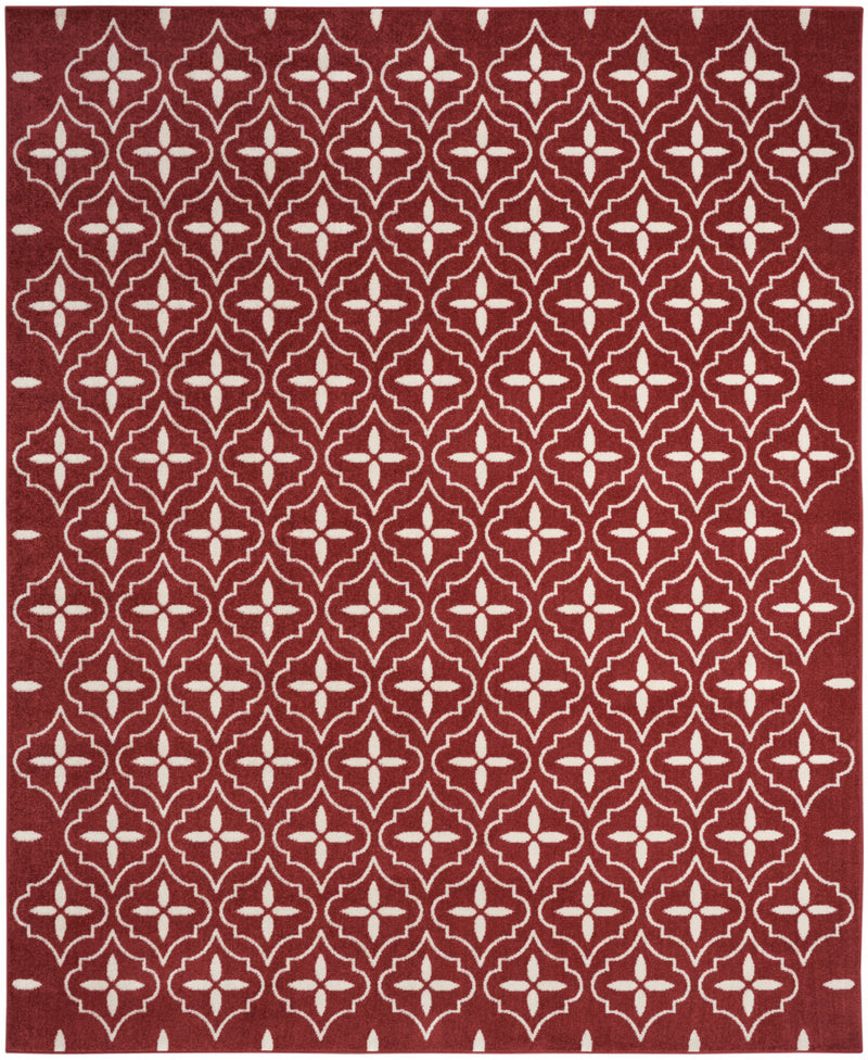 Brick red and ivory geometric indoor/outdoor area rug with repeating diamond floral pattern.
