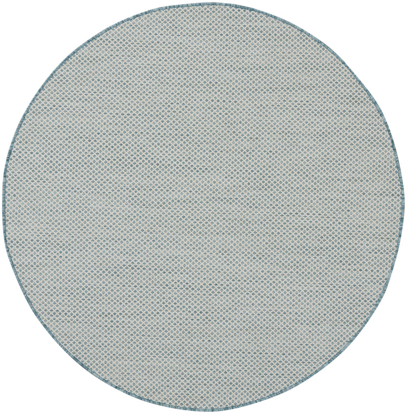 Round blue geometric rug with all-over small lattice pattern and thin blue perimeter