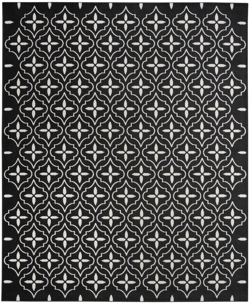 Square black area rug with repeating ivory geometric quatrefoil medallion pattern.