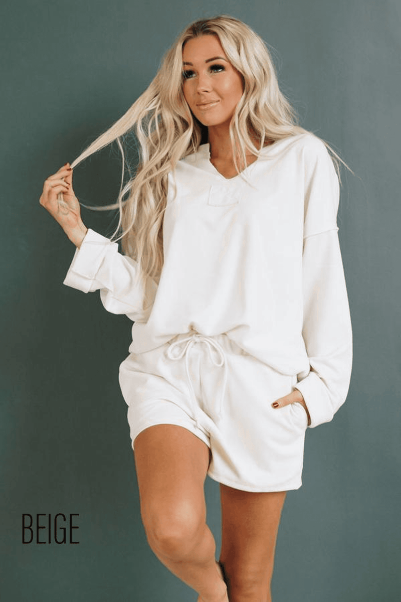 Women's white loungewear set, long-sleeve top with relaxed neckline and drawstring shorts