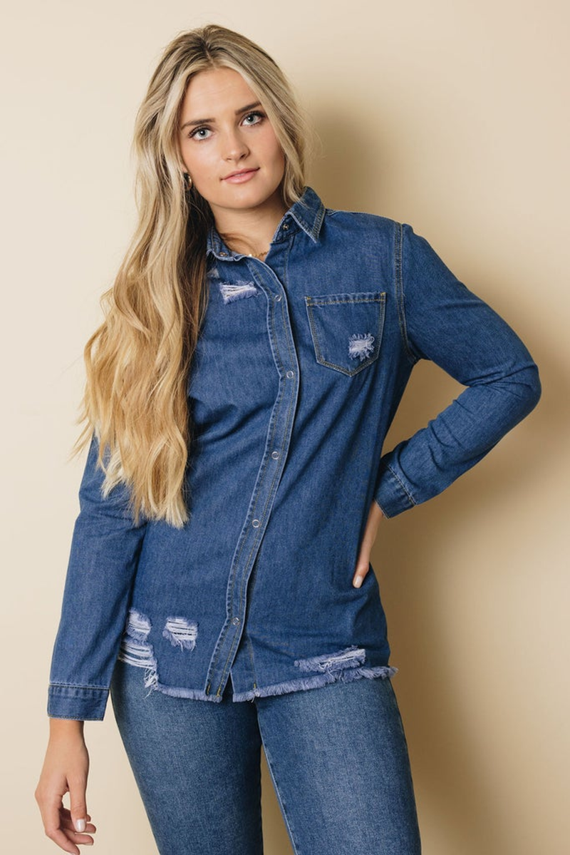 Blue denim button-up top with long sleeves, pointed collar, chest patch pocket, frayed edges
