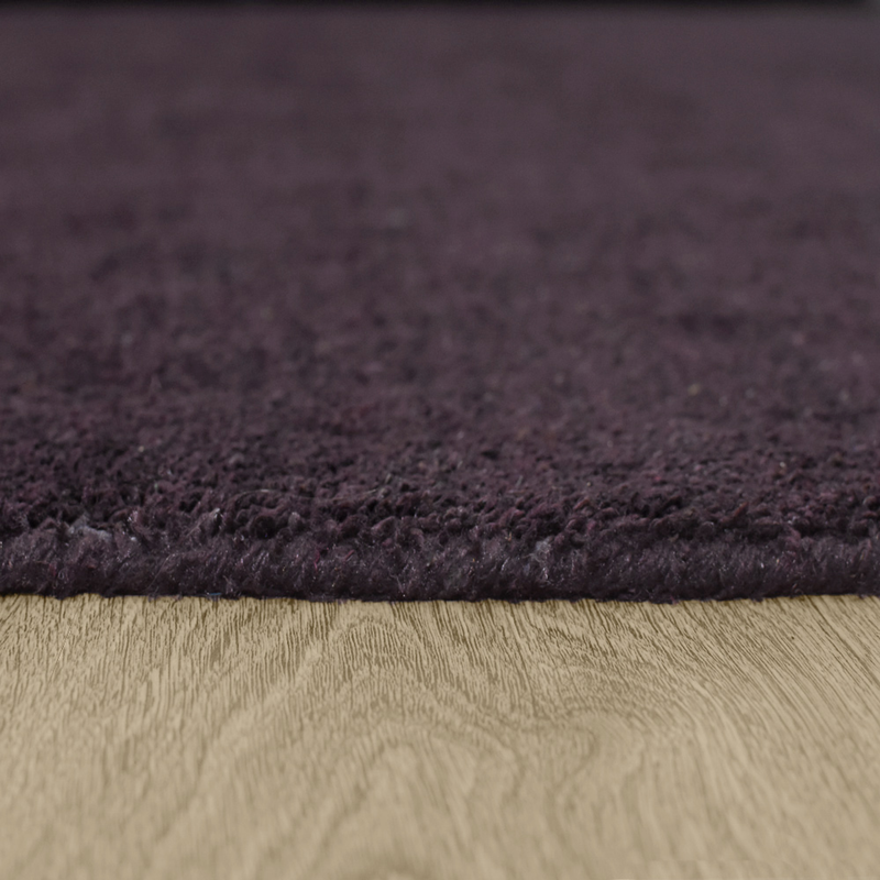 Dark purple hand-knotted silk-mix area rug, low pile with neat cut edge detail