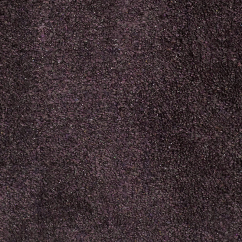 Dark purple hand-knotted silk-mix area rug, dense short pile close-up texture