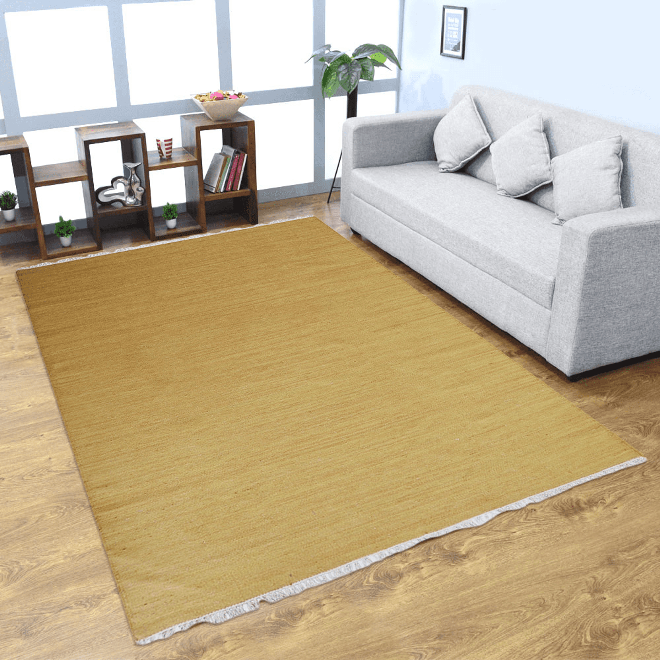 Mustard wool kilim area rug on wood floor with short fringe border