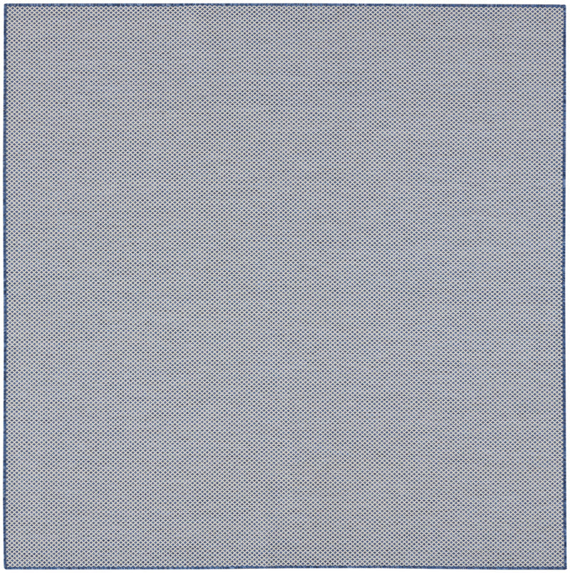 Indoor/outdoor area rug with light blue diamond micro-pattern and thin border