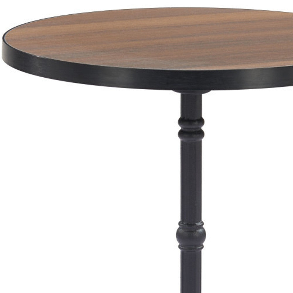 Walnut round tabletop with black pedestal column and turned base details