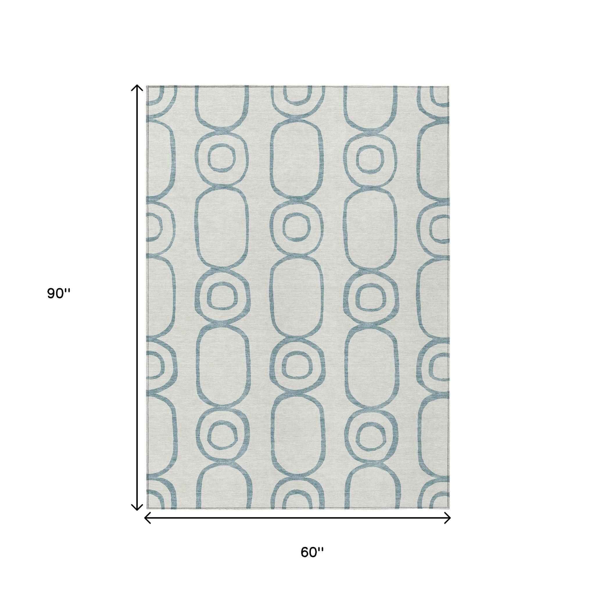 5' X 8' Teal Blue And Ivory Geometric Washable Indoor Outdoor Area Rug