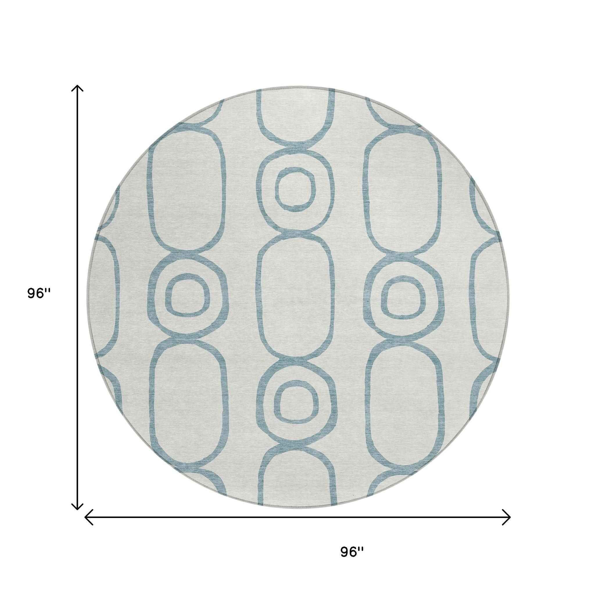 8' Teal Blue And Ivory Round Geometric Washable Indoor Outdoor Area Rug