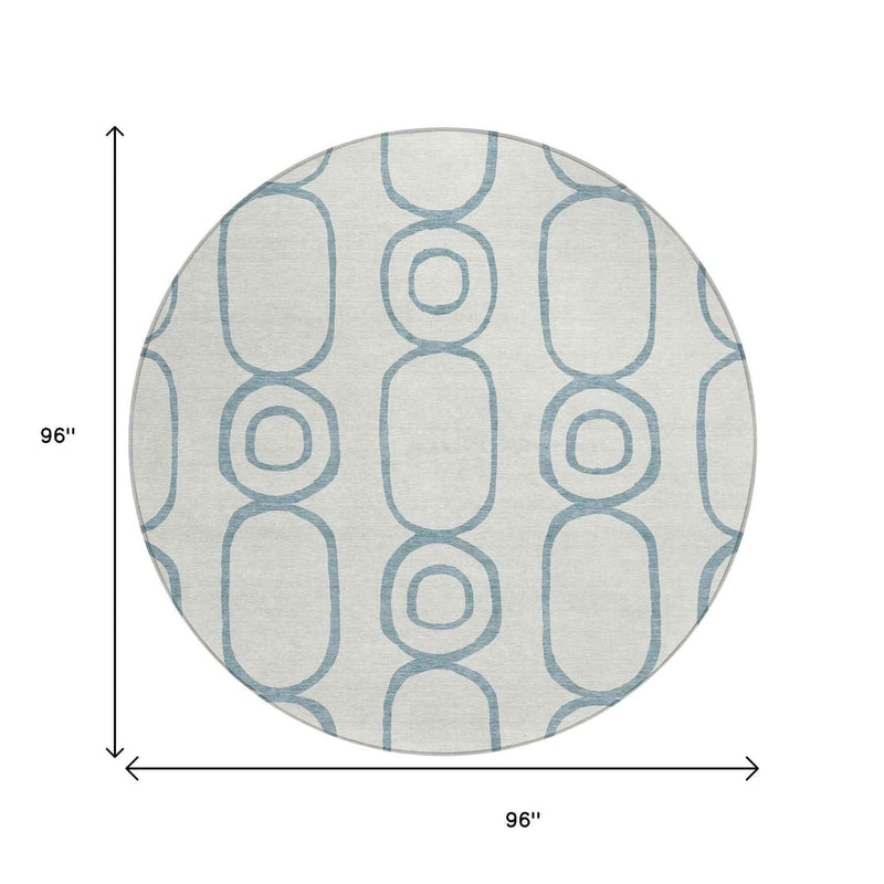 8' Teal Blue And Ivory Round Geometric Washable Indoor Outdoor Area Rug