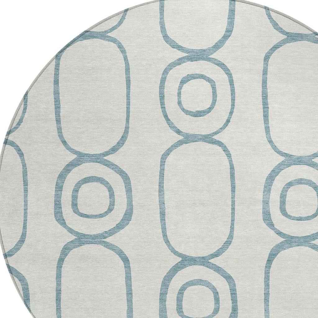 8' Teal Blue And Ivory Round Geometric Washable Indoor Outdoor Area Rug