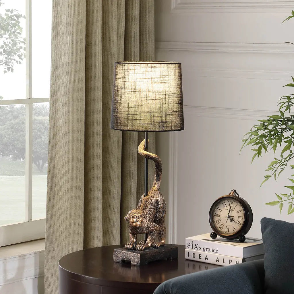 24" Antiqued Gold Monkey Table Lamp With Black Drum Shade - GreatEagleInc