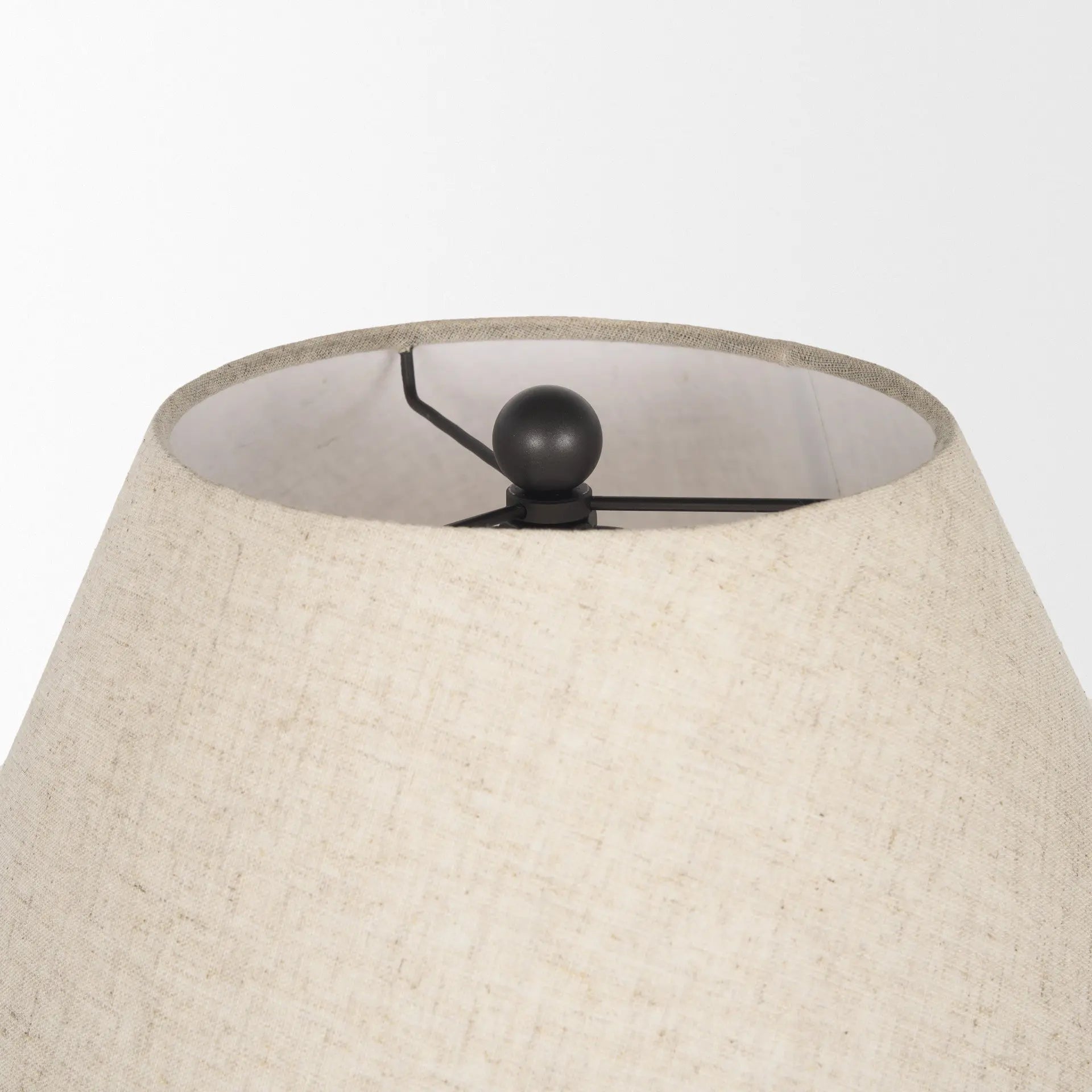 Natural linen lamp shade with a black metal spider fitting, perfect for a modern or transitional decor style.