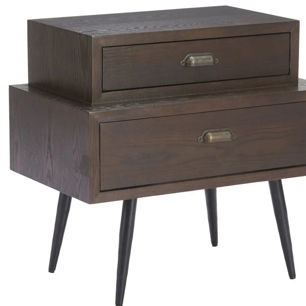 Mid-century style dark wood nightstand with two drawers and black tapered legs, featuring vintage brass pulls.